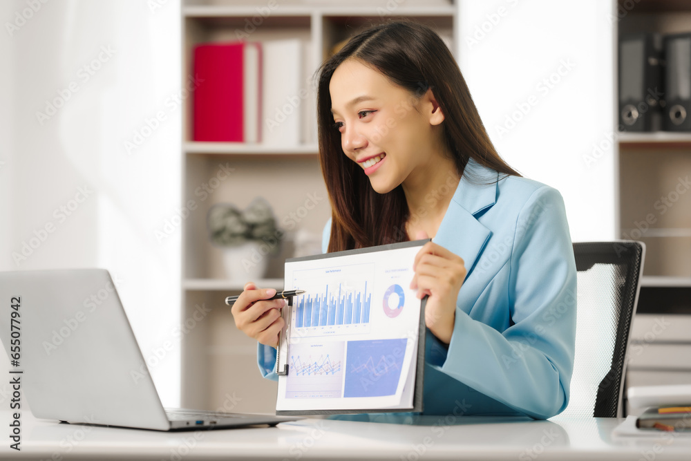 Confident Financial Businesswoman china people Offering Expert Investment Advice, professional confident businesswoman providing expert financial investment consultation services, charts and graphs