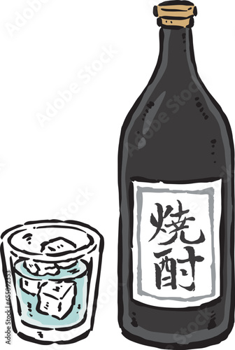 焼酎の入った瓶とグラス