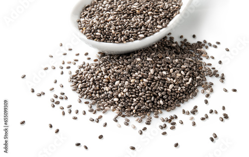 Chia seeds with ceramic spoon isolated on white background, close-up.