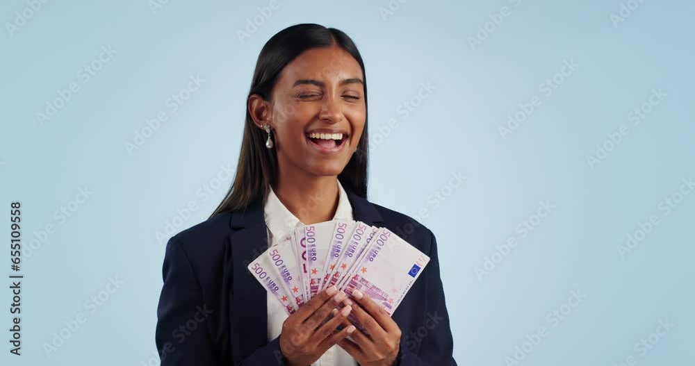 Business woman, winner and money success of finance investment and bonus, profit or cashback in studio. Face of indian person with cash, salary and savings or winning and wealth on blue background Business woman, winner and money success of finance investment and bonus, profit or cashback in studio. Face of indian person with cash, salary and savings or winning and wealth on blue background