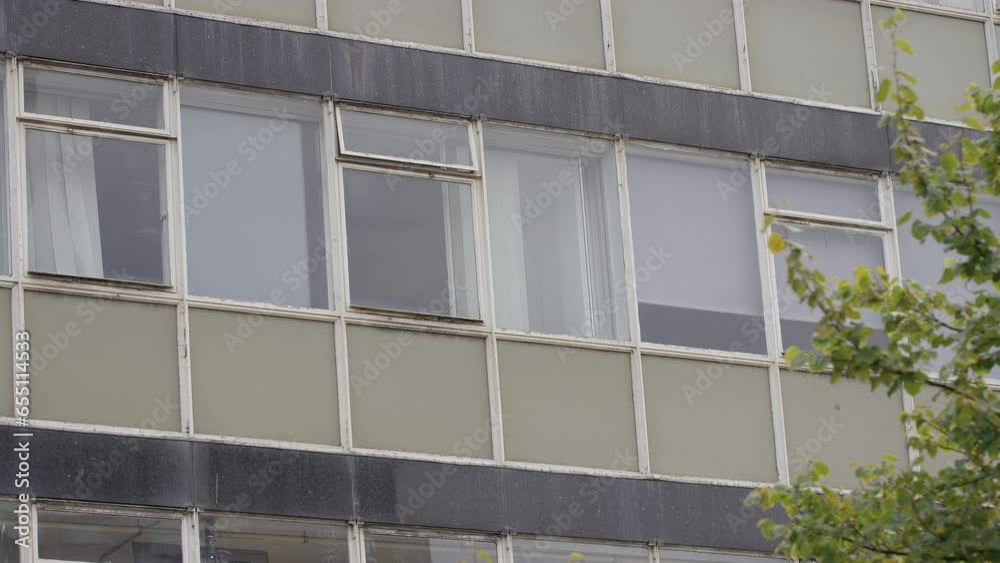 Exterior view of dilapidated office block windows Exterior view of dilapidated office block windows