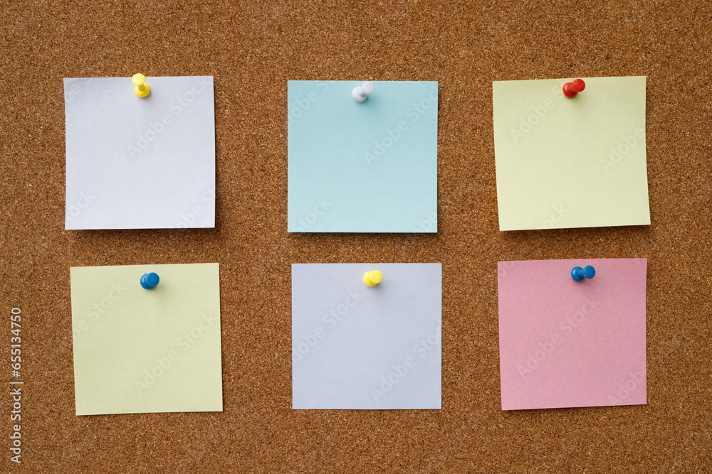 collection of colorful variety post it. paper note reminder sticky notes pin paper blue on cork bulletin board. empty space for text. collection of colorful variety post it. paper note reminder sticky notes pin paper blue on cork bulletin board. empty space for text.