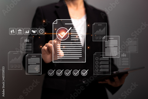 Document management concept, Businesswomen cheek finger on certificate electronic documents and document checklist management System and process automation efficient management  digital form checklist