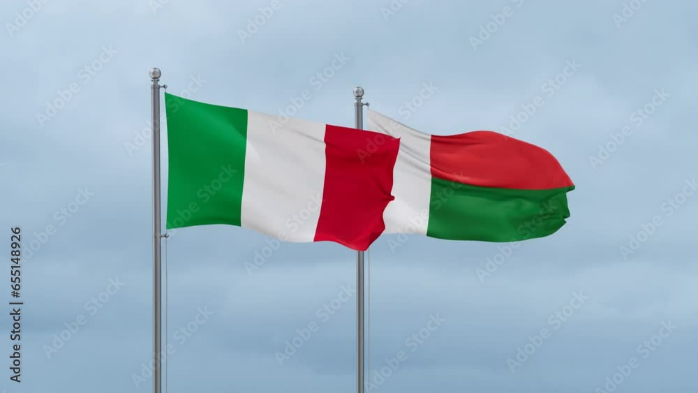 Madagascar flag and Italy flag waving together on cloudy sky, endless seamless loop, two country relations concept Madagascar flag and Italy flag waving together on cloudy sky, endless seamless loop, two country relations concept