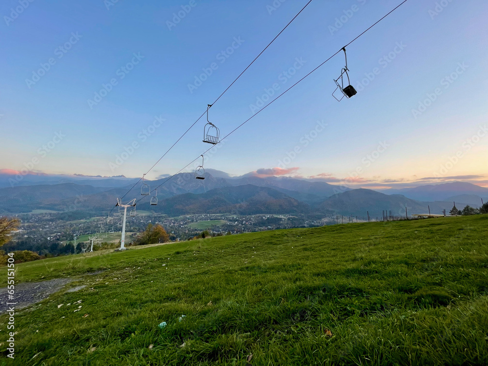 Cable car with open trailers in the mountains