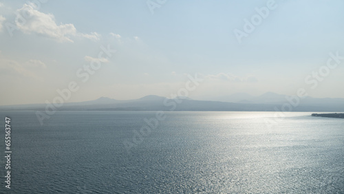 Sevan lake in October on a hazy day photo