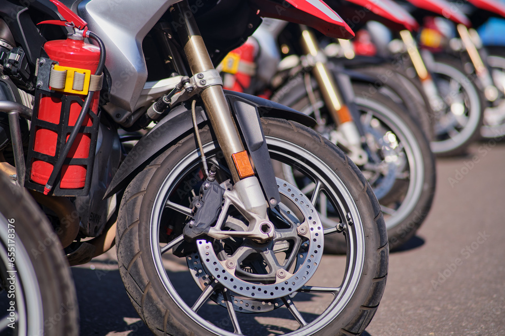 Close-up of a fire fighting motorcycle parked in a row on the street