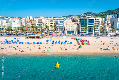 Resort town on the Mediterranean coast in Spain. Drone view of the main beach in the town Lloret de Mar, Girona  Spain  © Andreas May