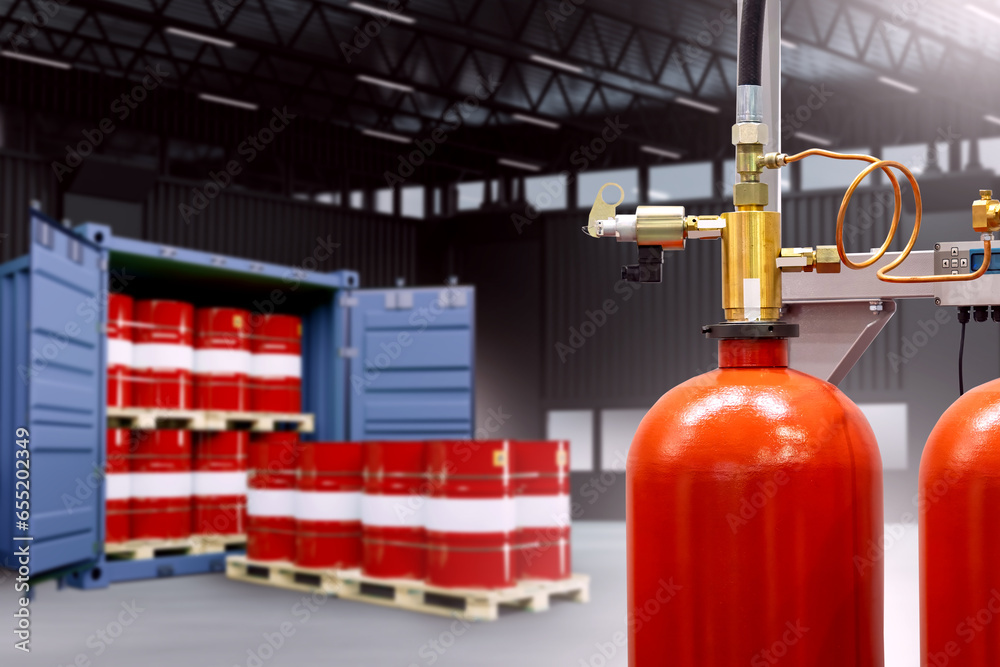 Fire extinguisher near fuel barrels. Fire extinguishing system in