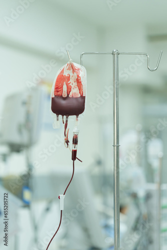 The patient is receiving blood components to replace lost blood to prevent hypovolemic shock. photo