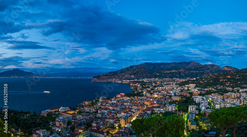 Panoramic view of Sorrento and Mount Vesuvius across the Bay of Naples in Italy at dusk