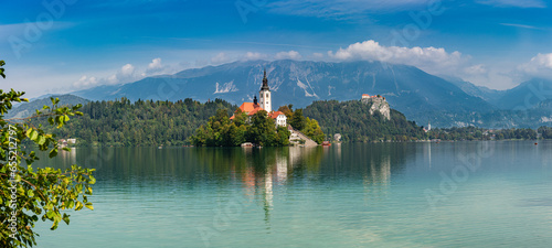 Lake Bled (Blejsko jezero) Slovenia. Beautiful mountain lake with small Pilgrimage Church. Most famous Slovenian lake and island Bled with Pilgrimage Church of the Assumption of Maria and Bled Castle  photo