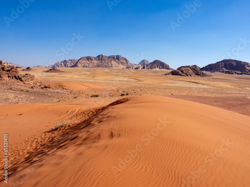 Red desert with dunes and stone in Wadi Rum, Jordan
