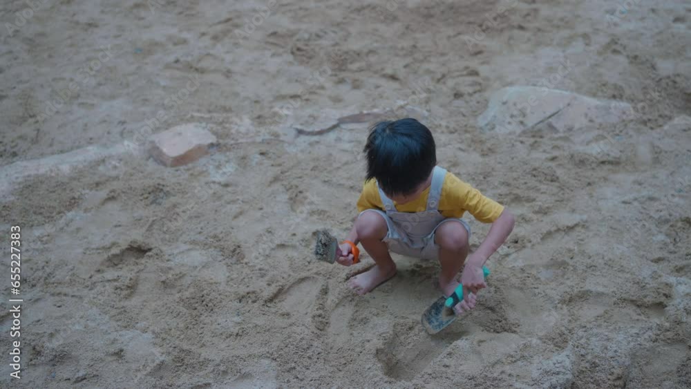 Happy asian lindergarten 5 year boy enjoying with outdoor city playground summer vacation Happy asian lindergarten 5 year boy enjoying with outdoor city playground summer vacation