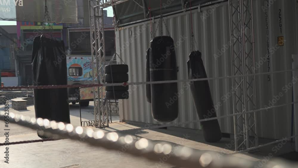 Empty boxing and martial arts area on street gym with many punching