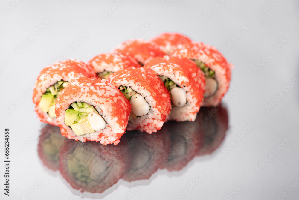 Sushi rolls in caviar isolated on white background with reflection. Japanese restaurant menu Sushi rolls in caviar isolated on white background with reflection. Japanese restaurant menu
