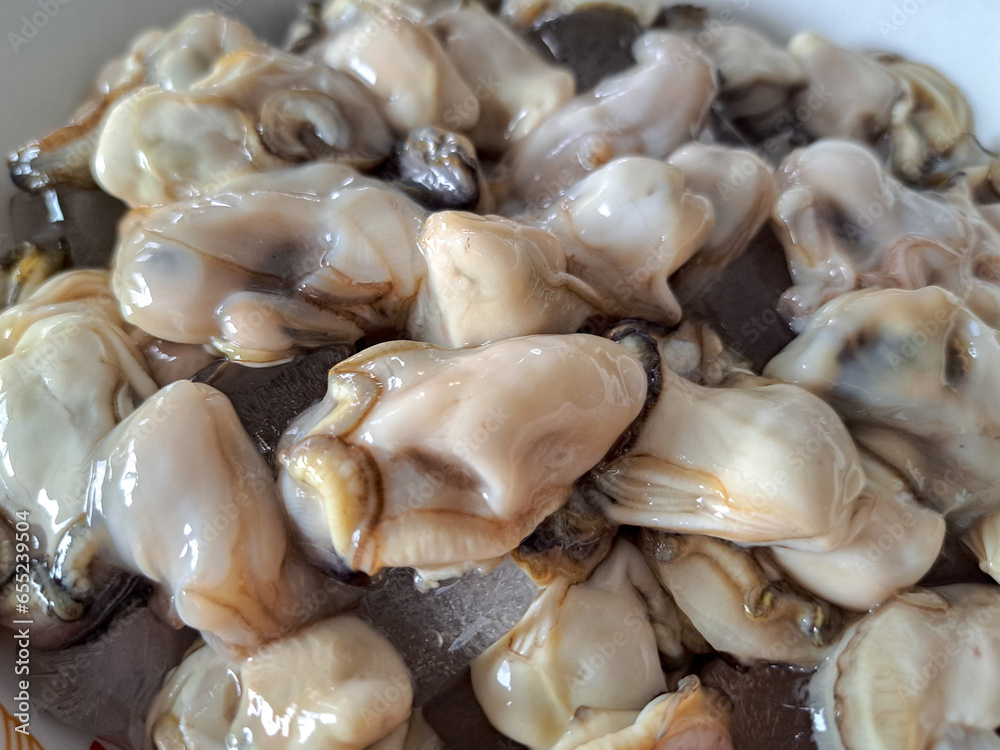 Fresh seafood, oyster meat taken from the shell Fresh seafood, oyster meat taken from the shell
