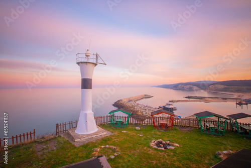 Fototapeta Naklejka Na Ścianę i Meble -  Colorful landscape and lighthouse in cloudy weather. Kıyıköy Turkey