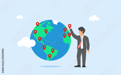 Expansion of business branches. Opening franchise in new location, Growing business worldwide concept. a bussinessman or CEO put a pin on world map. New franchise in different continent.