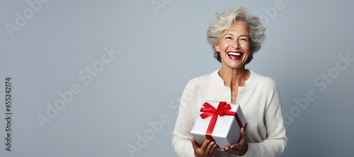 Happy Mature Woman Holding ...