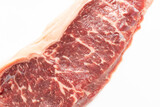 Raw piece of steak on a white background