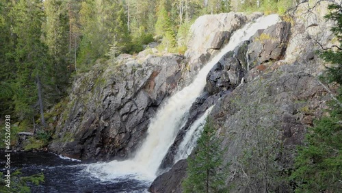 Hepokongas waterfall in Puolanka, Kainuu region, Finland. Early autumn season. photo