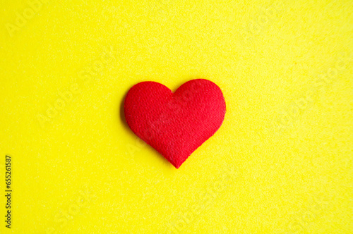 Heart shape on yellow background cover with customizable space for text or message. Love concept and copy space