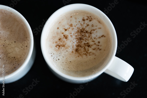 Cup of aromatic hot coffee in a white cup