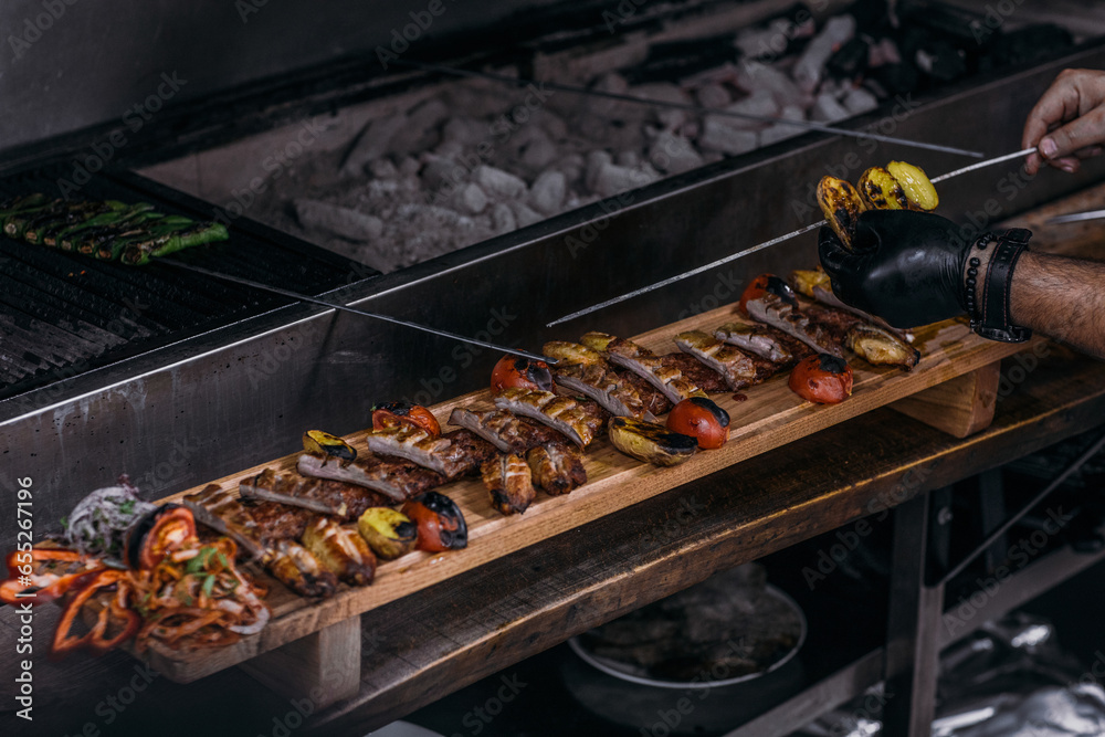 Luxury food in the restaurant. Barbecue,Grilled skewers on the grill. Grilled skewers on fireSalad on the table to serve. Dish on the table. Luxury food in the restaurant,