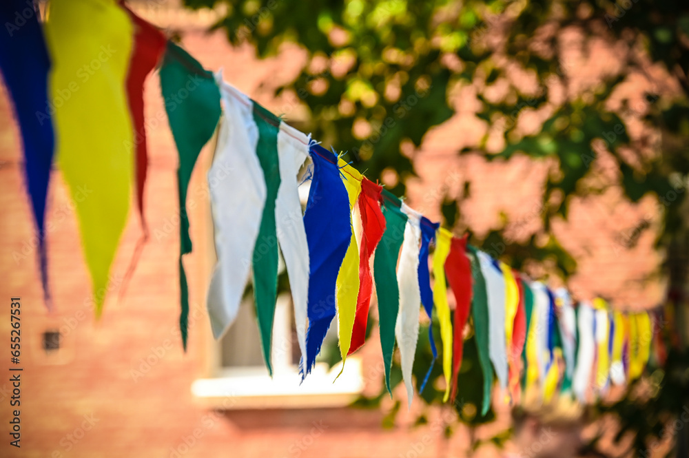 Festive multi-colored flags on a rope