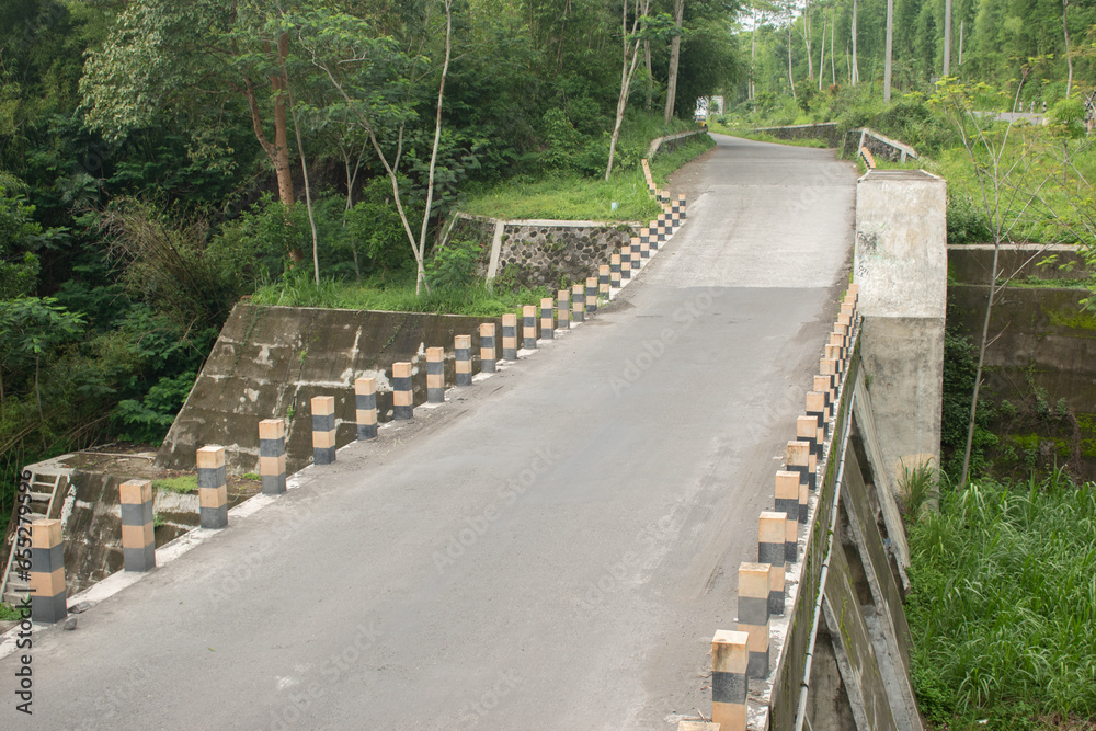 straight paved road over the bridge