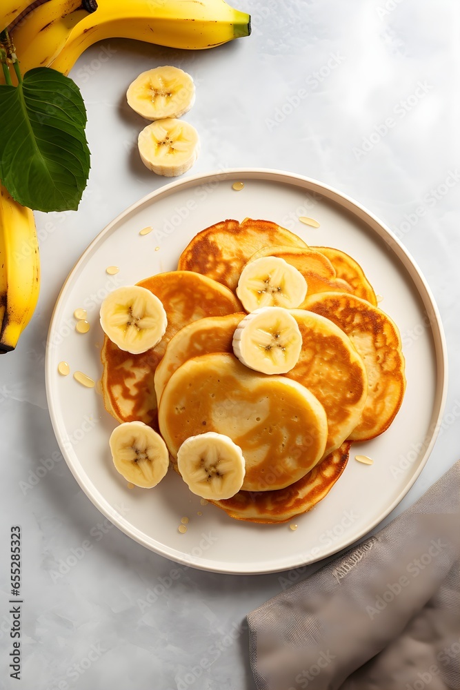 Pancakes with peanut butter, banana, walnut and honey. Healthy vegetarian breakfast concept, modern kitchen background, top view