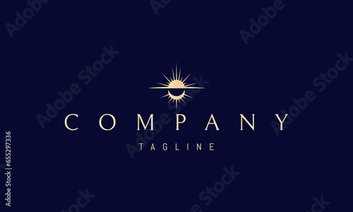 A vector golden logo with an abstract image of the sun and moon in the form of an alchemical symbol.