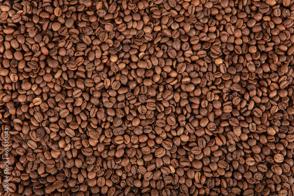 Roasted Coffee Beans. Dark roasted coffee beans with scoop on wooden background. Roasted Coffee Beans. Dark roasted coffee beans with scoop on wooden background.