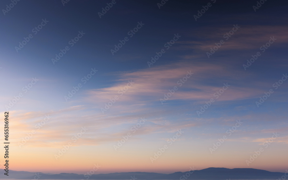 clouds on the sky at twilight. beautiful nature background in colorful light at dawnv