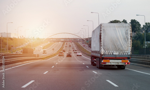 A truck on the intercity highway motorway with three lanes