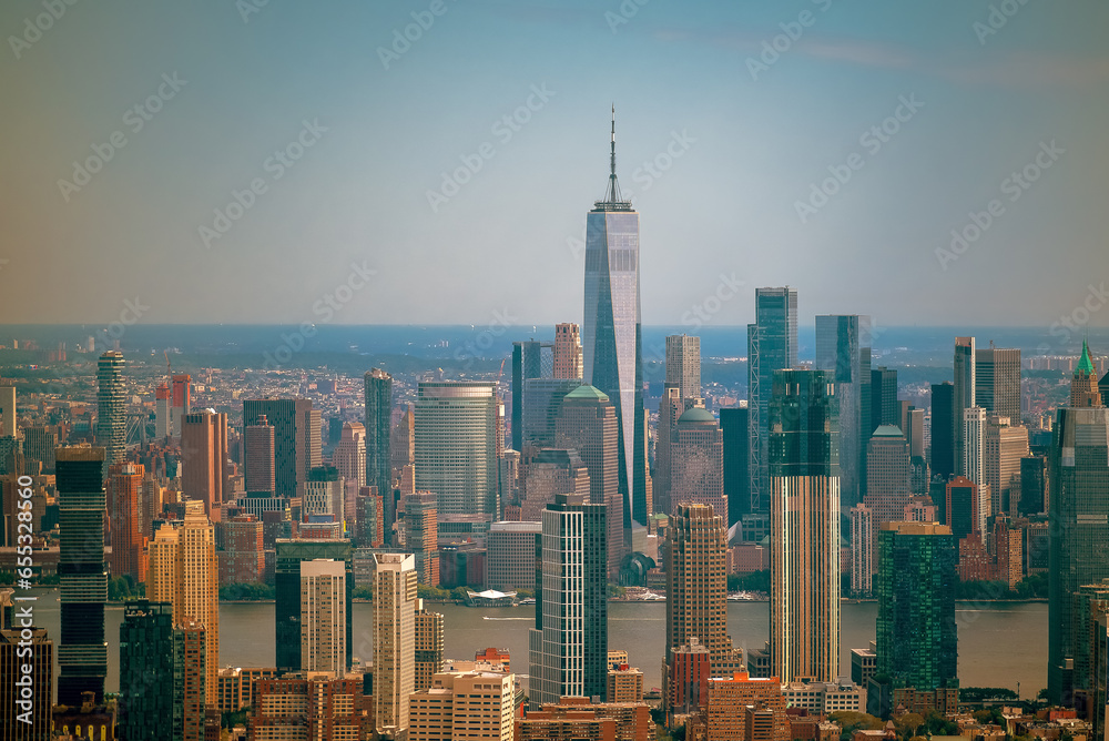 Fototapeta premium Aerial cityscape about The New york city's skyscrapers. Lower Manhattan business distict with One world trade center. Brooklyn is on the background with East river, Manhattan and Brooklyn bridges.