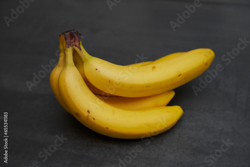 close up of bananas on a black board