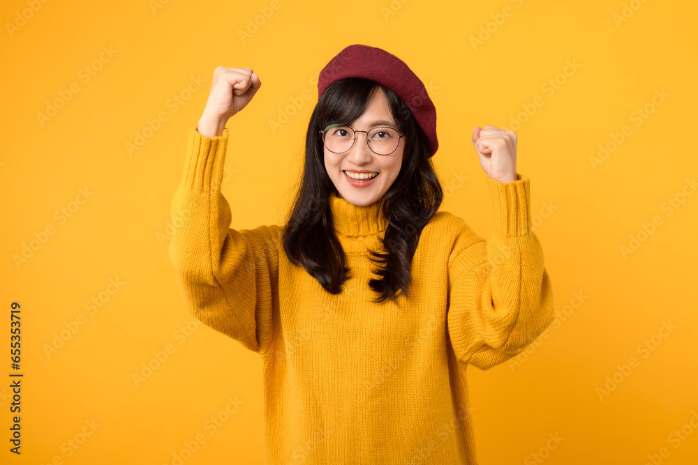 Trendy and irritated. A fashionable young woman, donning a red beret and yellow sweater, expresses her emotions against a vibrant yellow backdrop. Trendy and irritated. A fashionable young woman, donning a red beret and yellow sweater, expresses her emotions against a vibrant yellow backdrop.