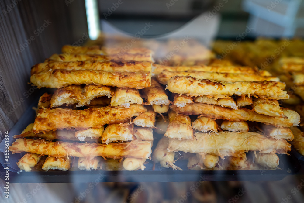 Puff pastry pie on display in a store window. Burek. Puff pastry pie on display in a store window. Burek.