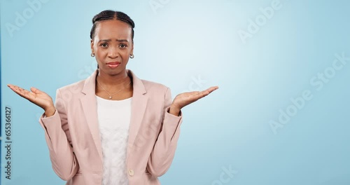 Confused, face and black woman with why hands in studio for choice, mistake or dont know on blue background. Decision, doubt and portrait of African female model with palm scale emoji, guess or shrug photo