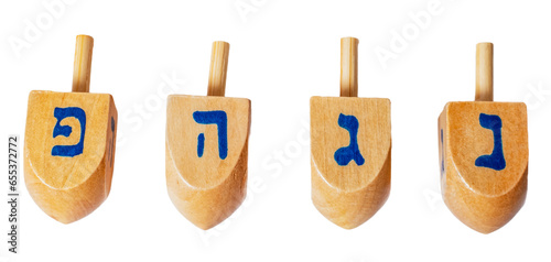 Wooden dreidels for Hanukkah isolated on white or transparent background. photo