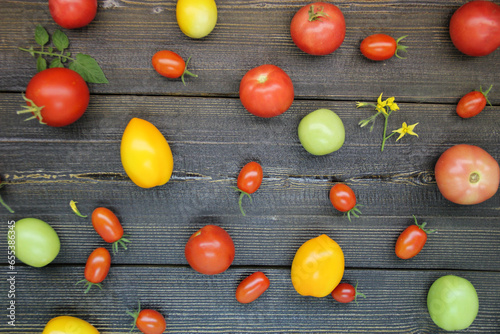 Fresh tomatoes on a wooden background