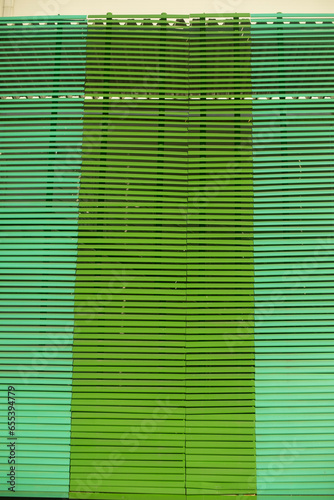 Large green blinds. Texture of blinds.Protection from light.