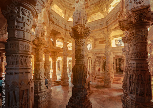 Bas-relief at columns at famous ancient Ranakpur Jain temple in Rajasthan state, India photo