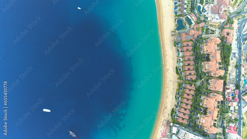 Aerial top view of a beach with white sand