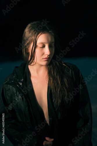 portrait of sad sodden woman in coat
