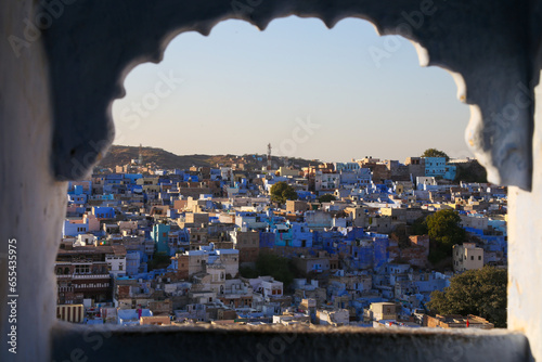 High angle view of Jodhpur, the blue city through a arabic style window. Rajasthan, India