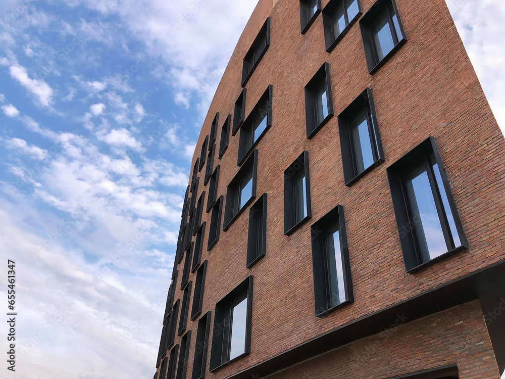 Architecture and real estate, residential apartment building with large panoramic windows, modern complex