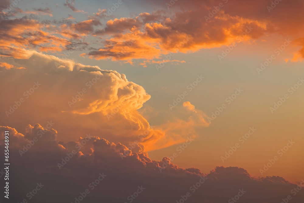 A close-up shot capturing the breathtaking beauty of the sunset-lit clouds over Lake Hefner
